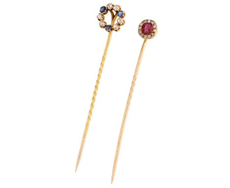 No Reserve - Lot of two yellow gold stick pins set with diamonds and ruby and sapphire. In fair condition. One diamond has a 