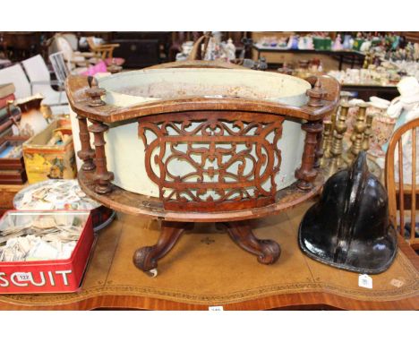Victorian walnut oval fretwork panelled planter on four scrolled legs.