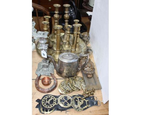 Collection of brass candle holders, horse brasses, door knocker, silver plated teapot, etc.