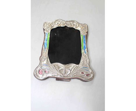 Embossed sterling silver easel photograph frame with enamel decoration, 21cm by 16cm.