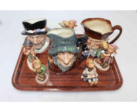 Three Royal Doulton character jugs and five Hummel figures.