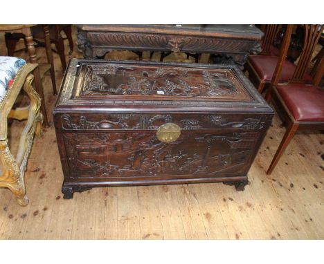 Oriental carved camphorwood trunk, 60cm by 101cm by 52cm.