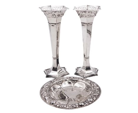 Pair of early 20th century silver specimen vases, each of faceted trumpet form with pierced flared rim, upon spreading filled