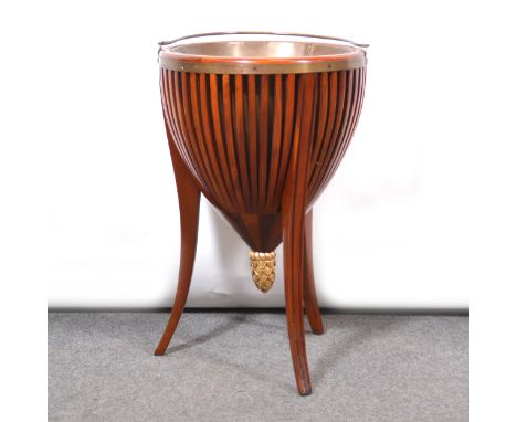 Mahogany jardiniere, Victorian style, circular tapering form with slatted sides, tripod splayed legs, brass liner and swing h