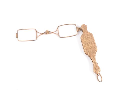 A pair of yellow metal folding glasses/ lorgnette, 19th century, engine turned and engraved finger grip, rounded rectangular 