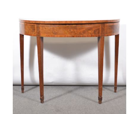 George III mahogany card table, demi-lune form, the foldover top with birdseye maple and rosewood crossbanding, boxwood strin