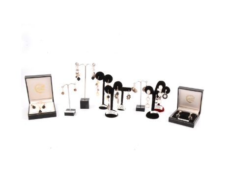 Ten pairs of new silver earrings for pierced ears, decorated with stones and enamel, a pendant and earrings suite, boxes and 