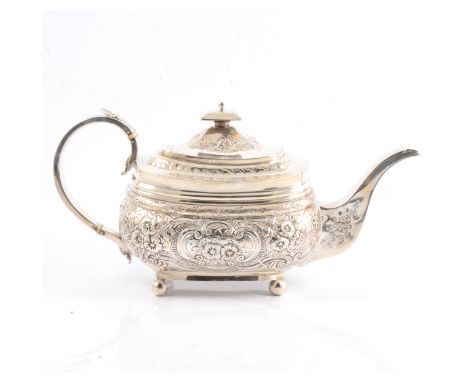 A George III silver teapot, Alexander Field, London 1813, rectangular form, repousse chased floral and scroll decoration, ivo