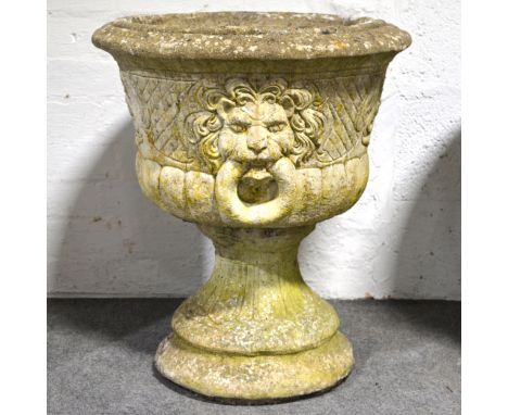 Pair of modern stone pedestal planters, circular bowls with cast baskets of flowers and lion ring masks, tapering column, dia