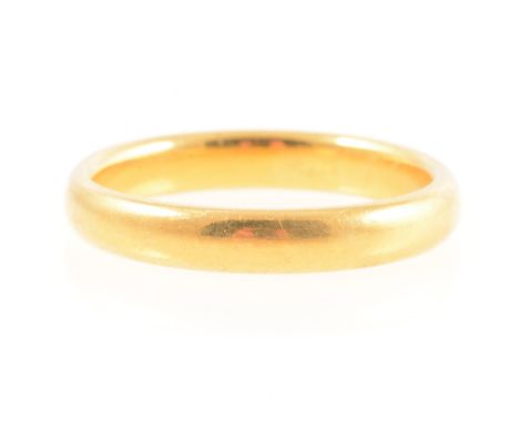 A 22 carat yellow gold wedding band, 3.5mm wide plain polished D shape, Birmingham 1924, ring size P, 5.8g.