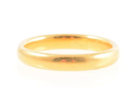 A 22 carat yellow gold wedding band, 3.5mm wide plain polished D shape, Birmingham 1924, ring size P, 5.8g.