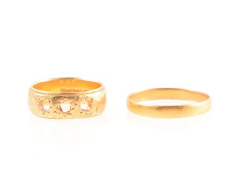 A 22 carat yellow gold wedding band, 3mm wide plain polished half D shape, Birmingham 1911, ring size R, 1.8g, an 18 carat ye