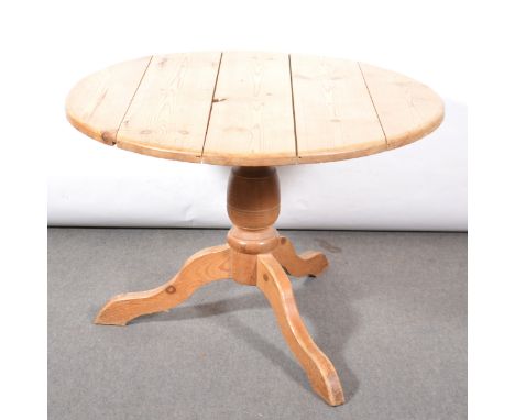 Pine pedestal kitchen table, circular boarded top, turned column, tripod base, diameter 109cm, height 77cm, and three spindle