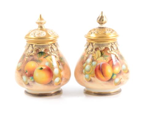 Pair of Royal Worcester pear-shape pot pourri vases and covers, painted with fruit, signed Roberts, 13cm high, one cover repa
