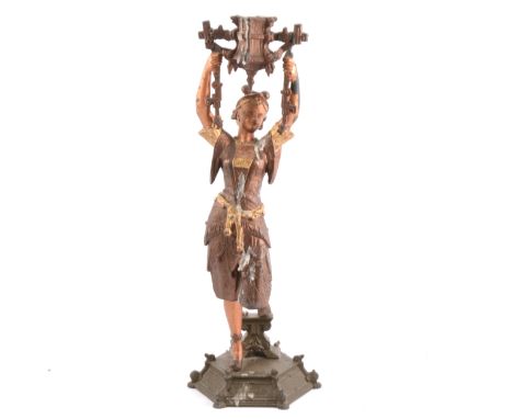 Spelter figure candlestick, designed as an attendant holding a lamp, 40cm.
