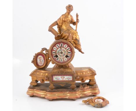 A 19th Century French gilt spelter mantel clock, figure surmount, enamelled porcelain dial and panels, French cylinder moveme