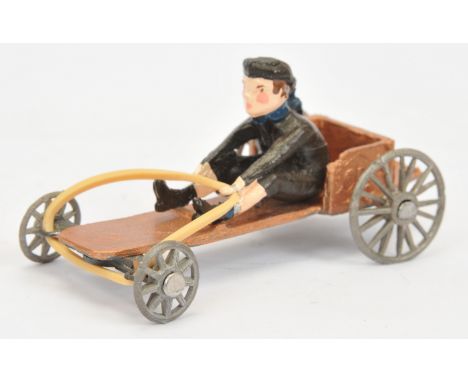 Matchbox Models of Yesteryear Scale Model "The Perfect Toy" MICA re-issue Soap Box Racer - bronze with driver figure who has 