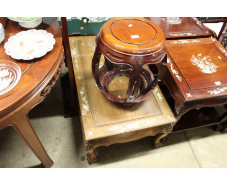 A Chinese hardwood and mother of pearl inlaid oblong coffee table with glass top 