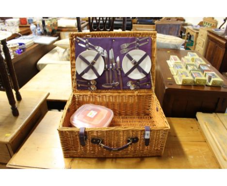 A wicker picnic hamper and contents 