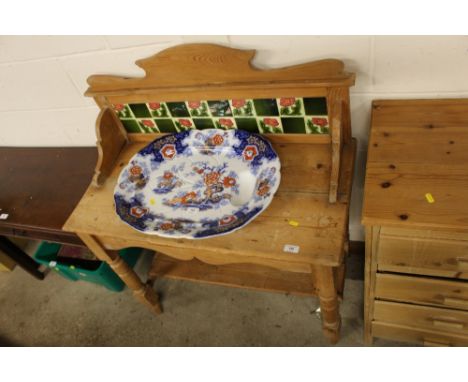A Victorian stripped pine and tile backed washstand 