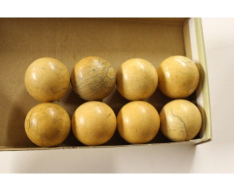 Eight ivory billiard balls 