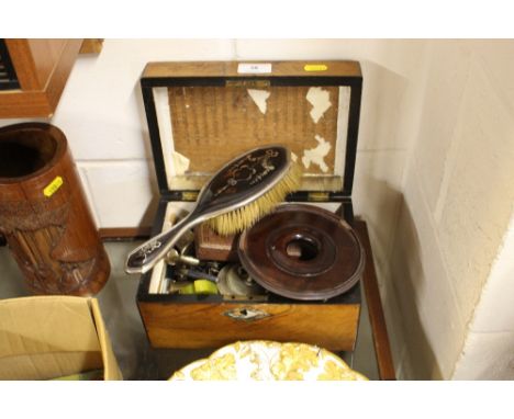 A Victorian walnut box containing a silver mounted dressing table  brush; old keys; a white metal caddy spoon etc. 