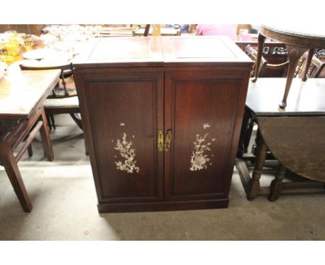 A Chinese hardwood and mother of pearl inlaid drinks cabinet / bar 