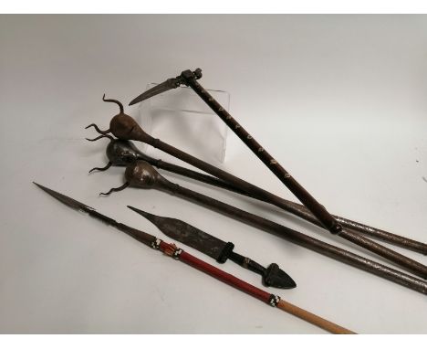 An Indo-Persian Zaghnal horseman's axe, length 51cm, together with three Indo-Persian deamon head maces,  a Zahn style spear 