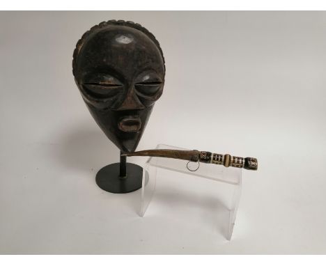 A Chockwe mask, Angola, length 30cm with an Algerian jimbaya knife (2)
