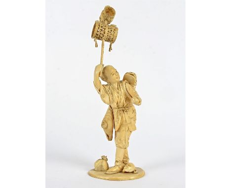 A Meiji period Japanese ivory okimono of a theatrical entertainer,  with mask by his feet and dragon shoulder ornament, heigh