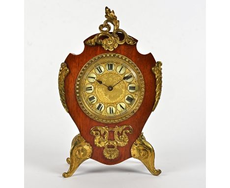 An early 20th Century French style clock, gilt dial decorated with a scene of a man looking across the ocean, with Roman nume