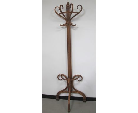 A flat backed bentwood coat and stick stand, 62cm x 204cm