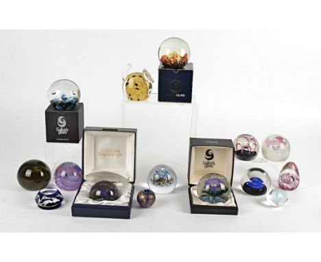 A quantity of 20th Century studio glass paperweights,  to include examples by Caithness, 'Critical Mass' with original certif