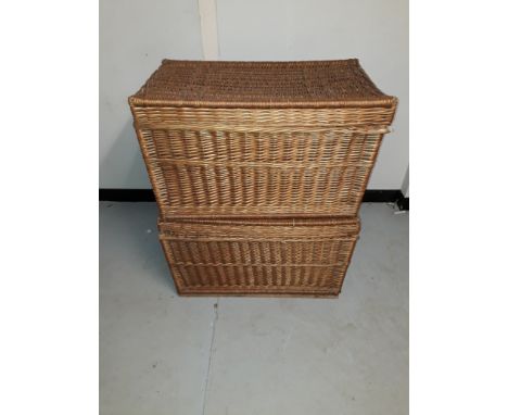 Vintage Laundry Hampers, a pair of wicker laundry hampers of tapering form with hinged lids (one requires replacement wire hi
