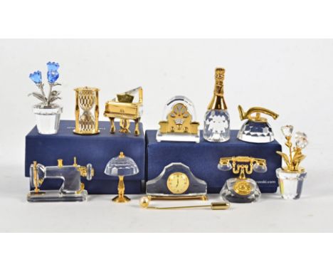 Ten Swarovski Crystal Memories models, of a telephone, pots of flowers, hourglass, radio, bottle of champagne, kettle, mantle