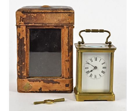 An early 20th Century carriage clock timepiece in case,  with enamel dial and Roman numerals, the case retailed by William An