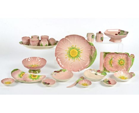 A group of Carlton Ware tablewares in the pink buttercup pattern, to include crescent shaped dishes, a salt and pepper set, a