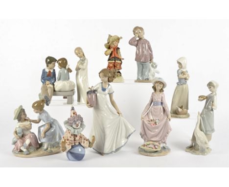 A collection of Lladro and Nao figures, comprising a Lladro 5813 'Having A Ball', 5027 'Flower Curtsey' and one of a girl fee