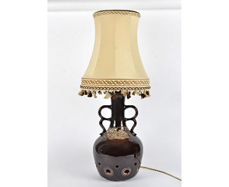 A West German or similar 20th Century pottery lamp,  with twin handles, multiple holes and volcanic rock effect, height 46cm,
