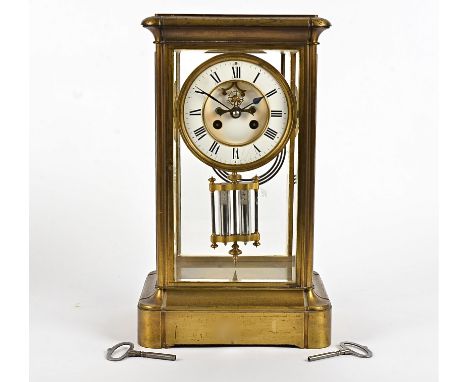 A late 19th Century French brass mantel clock, the 11.5cm white enamel dial with Roman numerals (some cracking), sunken centr