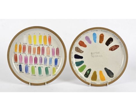 A pair of Midwinter pottery sample plates,  with various areas of tested colouring, diameter 27cm (2)