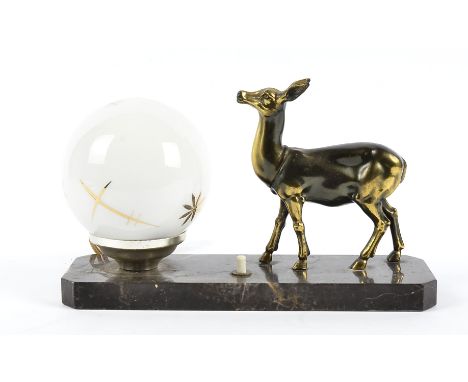 An Art Deco French table lamp,  modelled as a standing fawn on a black plinth base next to opaque white and gilt decorated gl