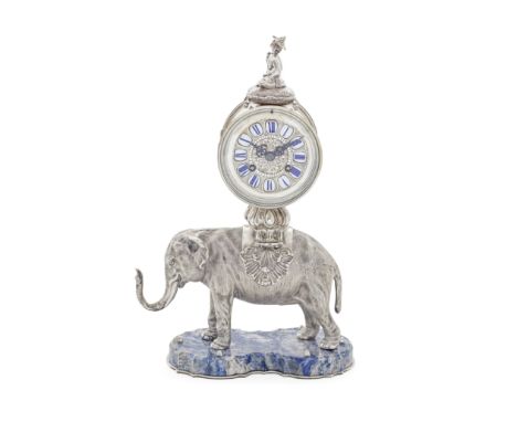 A late 19th century Rococo Revival silver and lapis lazuli elephant mantel clockno maker's mark, French 'Swan' mark stamped o