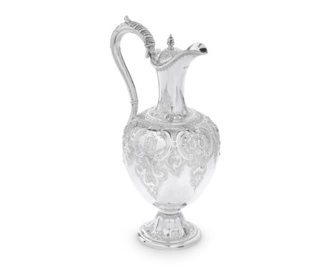 A Victorian silver ewerMartin, Hall &amp; Co, Sheffield 1861 Bulbous form body, embossed with foliate and scroll panels, cart