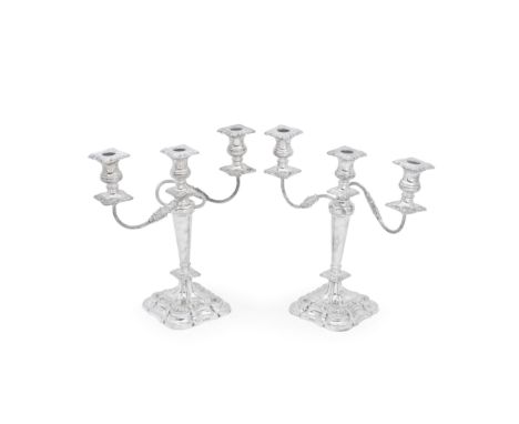 A pair of silver three-light candelabraE Viner, Sheffield 1963With reeded scroll arms issuing from below a central light, tap