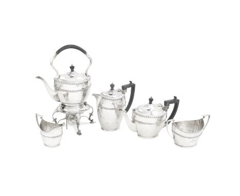 A silver five-piece tea and coffee service  including kettle on standR F Mosley &amp; Co, Sheffield 1913, kettle 1914 Oval fo