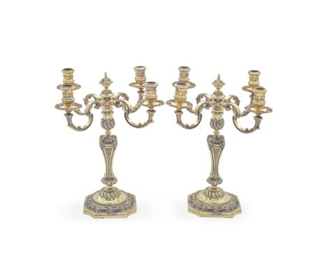 A pair of 18th century style cast silver-gilt four-light candelabra, after Paul de LamerieC J Vander Ltd, London 1972 The det