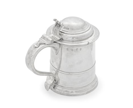 A George I Britannia standard silver lidded tankardHenry Jay, London 1718 Cylindrical body with an applied girdle on a moulde