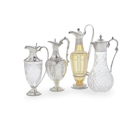 A collection of four silver claret jugsComprising: a silver-mounted Bohemian glass decanter, Robinson, Edkins &amp; Aston, Bi