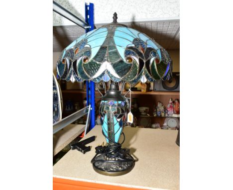 A TIFFANY STYLE TABLE LAMP by Minister Stylish Living, the baluster shaped body has a twin bulb fitting to the top and a sing